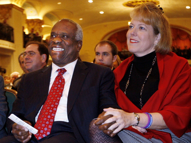Supreme Court Justice Clarence Thomas and his wife, Virginia, listen as he is introduced prior to speaking at the Federalist Society in Washington on Nov. 15, 2007. The Thomases drew criticism for Virginia's role as co-founder, president and CEO of Liberty Central, a political group that advertises itself as linked to the Tea Party movement. She later stepped down.