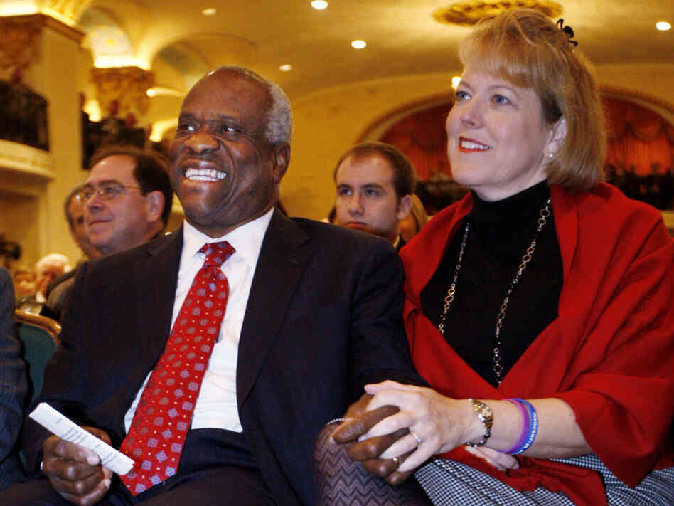 Supreme Court Justice Clarence Thomas and his wife, Virginia, listen as he is introduced prior to speaking at the Federalist Society in Washington on Nov. 15, 2007. The Thomases drew criticism for Virginia's role as co-founder, president and CEO of Liberty Central, a political group that advertises itself as linked to the Tea Party movement. She later stepped down.