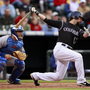 Catcher Brad Ausmus (left), with the L.A. Dodgers in May 2009, is at the ready as the Colorado Rockies' Todd Helton bats during a game in Denver. Catcher Brad Ausmus (left), with the L.A. Dodgers in May 2009, is at the ready as the Colorado Rockies' Todd Helton bats during a game in Denver.
