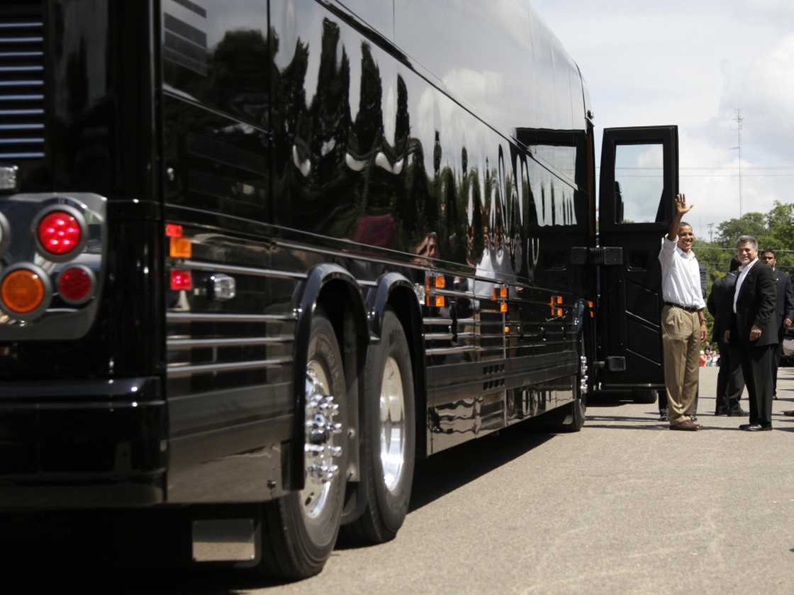 Bus Stop: President Obama waves before boarding his bus after having lunch and greeting people at The Old Market Deli on Monday,  in Cannon Falls, Minn., during his three-day economic bus tour.