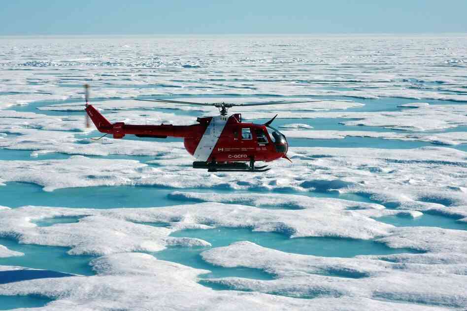 The ship's helicopter will often check to see what ice conditions are ahead of the Louis. An ice specialist can help gauge the thickness of ice by its color and shape.