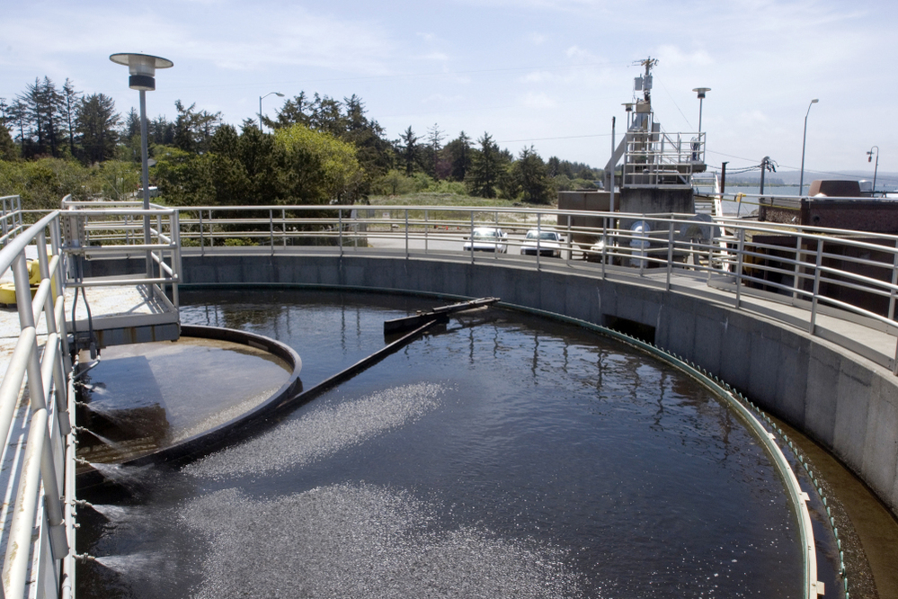 A boom sweeps around a tank at a sewage treatment plant in Coos Bay, Ore. Even though sewage water can be treated and cleaned, psychologists say getting the "cognitive sewage" out of the water is much more difficult.