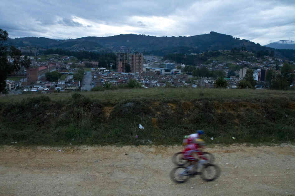 Two riders from a cycling academy ride during an early morning hill training session in Duitama.