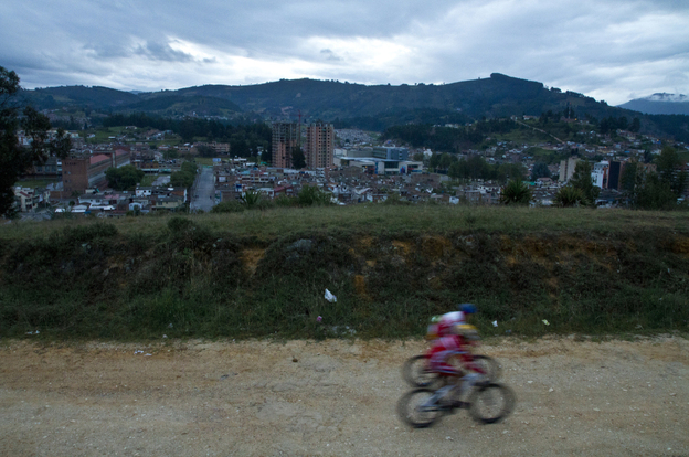 Two riders from a cycling academy ride during an early morning hill training session in Duitama.
