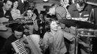 February 1957: Bill Haley's band The Comets play in the cramped space of a railway carriage en route to London. (Photo by Harry Kerr/BIPs/Getty Images) February 1957: Bill Haley's band The Comets play in the cramped space of a railway carriage en route to London. (Photo by Harry Kerr/BIPs/Getty Images)