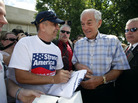 Rep. Ron Paul signs an autograph during the Ames Straw Poll, in Iowa, Saturday, Aug. 13, 2011. Rep. Ron Paul signs an autograph during the Ames Straw Poll, in Iowa, Saturday, Aug. 13, 2011.