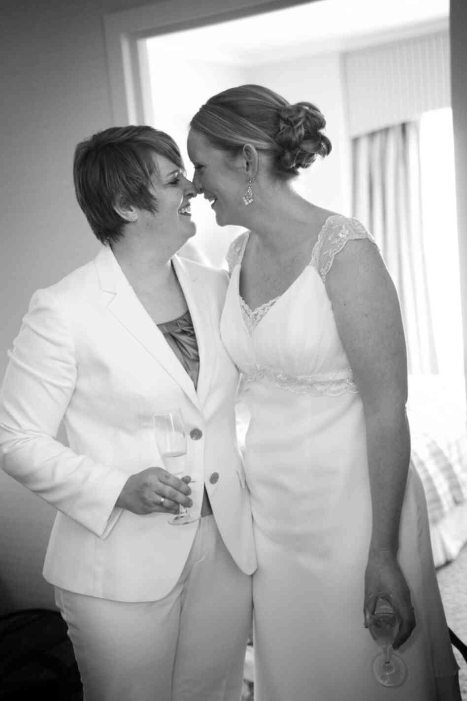 Bernadette Coveney Smith, left, shares a special moment with her wife Jennifer Coveney Smith, right, during their wedding.