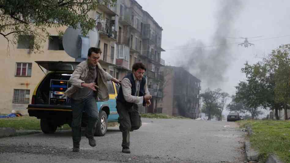 The Thin, Unread Line: From left, Thomas (Rupert Friend) and Sebastian (Richard Coyle) are war reporters struggling to comprehend both the Russia-Georgia conflict and the outside world's tepid response to their coverage. In the summer of 2008, most TV outlets were focused on the Olympics instead. The Thin, Unread Line: From left, Thomas (Rupert Friend) and Sebastian (Richard Coyle) are war reporters struggling to comprehend both the Russia-Georgia conflict and the outside world's tepid response to their coverage. In the summer of 2008, most TV outlets were focused on the Olympics instead.
