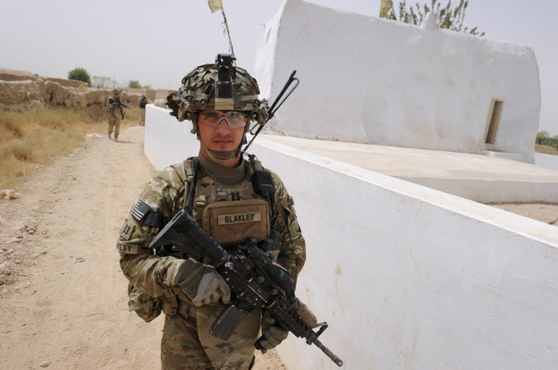 Captain Michael Blakley, company commander of Battle Co., 1-32 Infantry Battalion, 3rd Brigade Combat Team, accompanied by Afghan National Army soldiers leads the patrol at the Mullah Omar mosque in Sangsar village in Kandahar province, the heartland of Taliban in southern Afghanistan.
