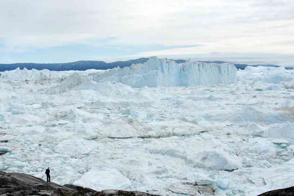 The little Arctic town of Ilulissat is tucked between the sea and a gigantic ice cap that covers most of the island.