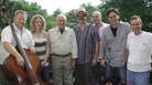 Tom T. Hall (third from left) poses with some of the collaborators who helped remake Songs of Fox Hollow, including co-producers Eric Brace (third from right) and Peter Cooper (second from right). Tom T. Hall (third from left) poses with some of the collaborators who helped remake Songs of Fox Hollow, including co-producers Eric Brace (third from right) and Peter Cooper (second from right).