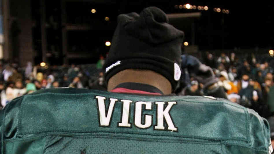 Michael Vick walks off the field after losing to the Green Bay Packers in January 2011.