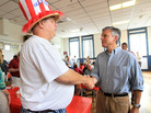 Jon Huntsman, r, shakes a man's hand in Nashua, N.H., Saturday, Aug. 13, 2011. Jon Huntsman, r, shakes a man's hand in Nashua, N.H., Saturday, Aug. 13, 2011.