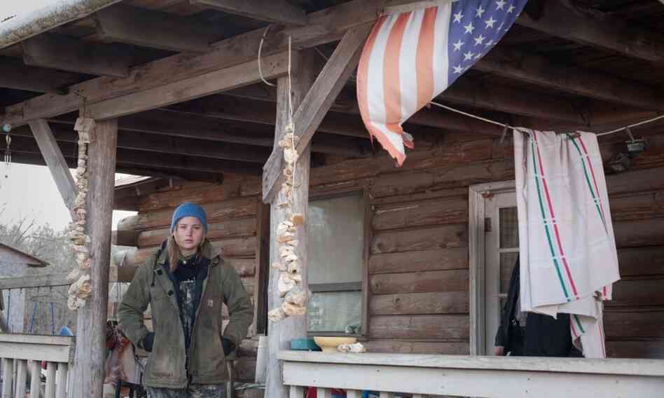Jennifer Lawrence, as Ree Dolly in Winter's Bone, on the front porch of Frank Layson's house in southwestern Missouri. Layson's hand-built house served as the home for the Dolly children in the film. Jennifer Lawrence, as Ree Dolly in Winter's Bone, on the front porch of Frank Layson's house in southwestern Missouri. Layson's hand-built house served as the home for the Dolly children in the film.