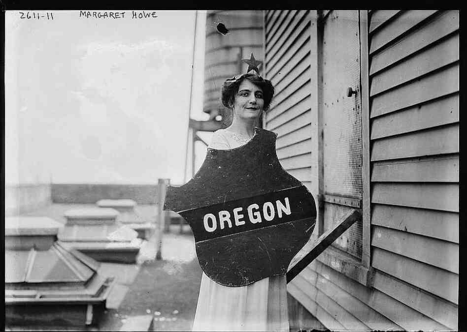 Actress Margaret Vale was the niece of President Woodrow Wilson and an active suffragist. Here she holds the emblem representing the Oregon delegation at a women's suffrage parade, 1913.