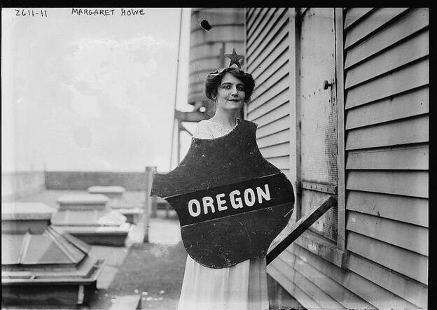 Actress Margaret Vale was the niece of President Woodrow Wilson and an active suffragist. Here she holds the emblem representing the Oregon delegation at a women's suffrage parade, 1913.