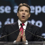 Texas Gov. Rick Perry prays at The Response, his call to prayer for a nation in crisis, on Aug. 6 in Houston. The event was organized, in part, by members of the New Apostolic Reformation.