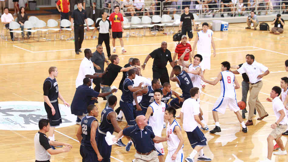 Basketball players from Georgetown University and China's Bayi Rockets team traded punches during their game Thursday (Aug. 18, 2011) in Beiing.