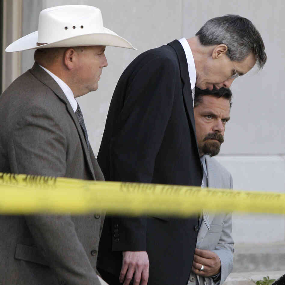 Warren Jeffs, center, leaving a courthouse in San Angelo, Texas, on Aug. 4, 2011.
