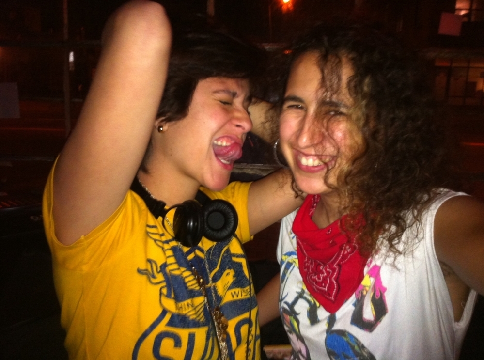 DJ Mafe (left) and DJ Rat revel in a recent Latin alternative dance party.