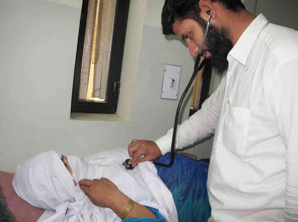 Dr. Muhammad Arif Khan examines Marcia, a young woman who is expecting her first child. In accordance with strict social taboos against female patients exposing themselves to male doctors, he was only able to examine her through her clothes. Dr. Muhammad Arif Khan examines Marcia, a young woman who is expecting her first child. In accordance with strict social taboos against female patients exposing themselves to male doctors, he was only able to examine her through her clothes.
