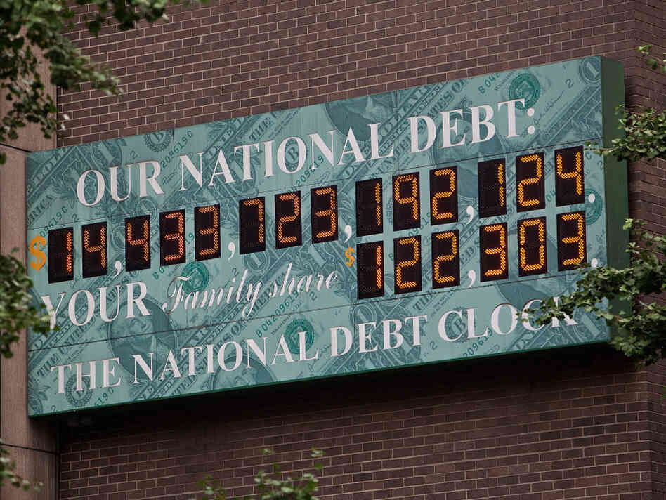 $14.4 trillion and counting: The National Debt Clock, a billboard-size digital display showing the increasing U.S. debt, is seen in New York City on Aug. 1. $14.4 trillion and counting: The National Debt Clock, a billboard-size digital display showing the increasing U.S. debt, is seen in New York City on Aug. 1.