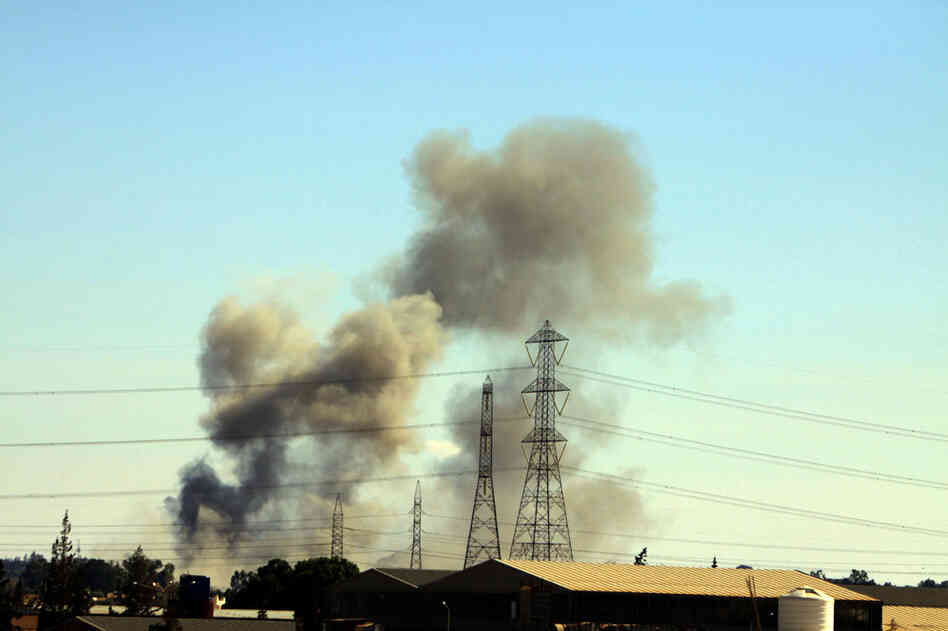 Smoke billows from Tajura, a suburb of Tripoli, following a NATO airstrike on Thursday. 