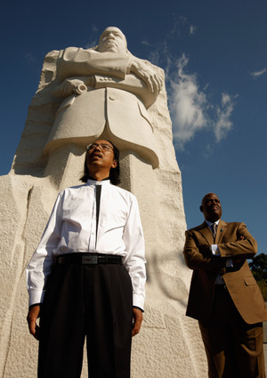 Master Sculptor Lei Yixin and Harry Johnson, president and CEO of the Martin Luther King Jr. National Memorial Project Foundation, stand at the base of the 30-feet-tall sculpture at the new King memorial. Master Sculptor Lei Yixin and Harry Johnson, president and CEO of the Martin Luther King Jr. National Memorial Project Foundation, stand at the base of the 30-feet-tall sculpture at the new King memorial.