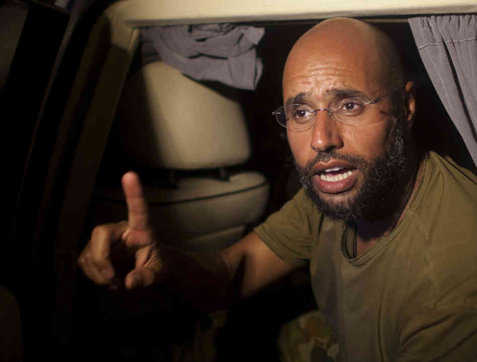 Moammar Gadhafi's son, Seif al-Islam speaks outside of the Rixos hotel in Tripoli, Libya, Tuesday, Aug. 23. Moammar Gadhafi's son, Seif al-Islam speaks outside of the Rixos hotel in Tripoli, Libya, Tuesday, Aug. 23.