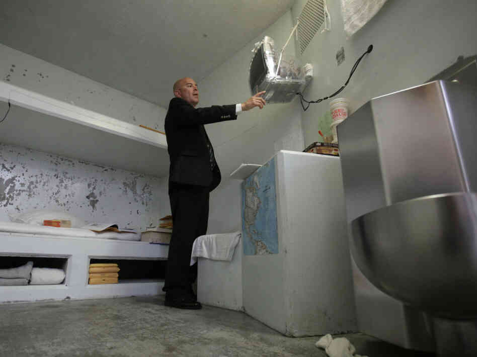Correctional Officer Lt. Christopher Acosta  turns on a television in a cell in the Secure Housing Unit at Pelican Bay State Prison near Crescent City, Calif., on Aug. 17.  State prison officials allowed the media to tour Pelican Bay's SHU, where inmates are isolated.