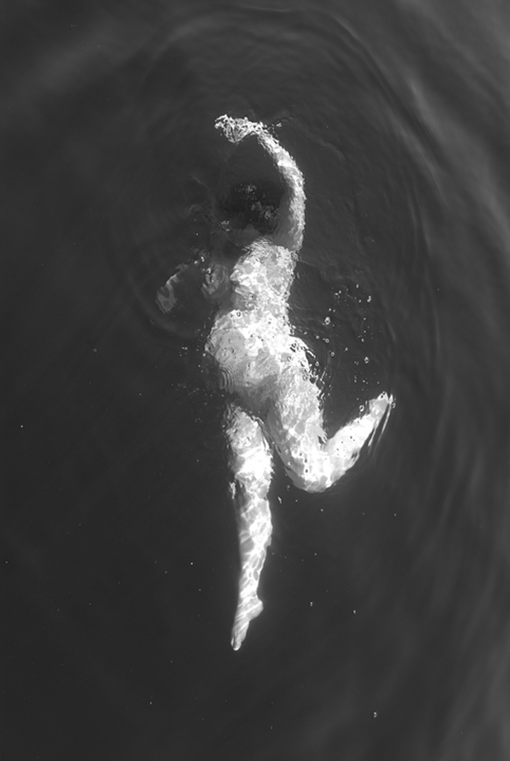 Sarah, shown in this image taken by a friend/photographer, says she felt "ugly" in her pregnant body. While taking this photo, she says, she felt almost graceful.