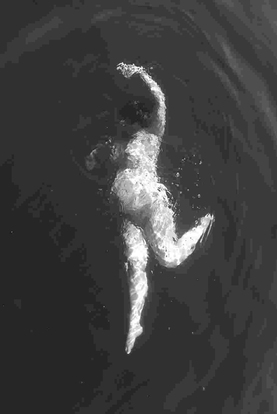 Sarah, shown in this image taken by a friend/photographer, says she felt "ugly" in her pregnant body. While taking this photo, she says, she felt almost graceful.