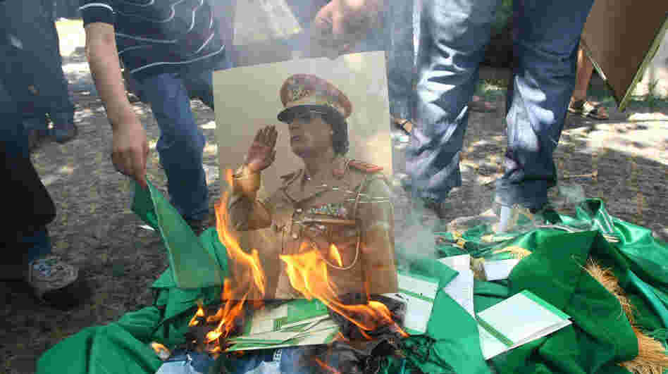 Protesters burn a portrait of Libyan leader Moammar Gadhafi and copies of his Green Book outside the Libyan Embassy in Ankara. Turkey, on Monday. Libyan rebels have taken many parts of the Libyan capital, Tripoli, as they try to oust Gadhafi. Protesters burn a portrait of Libyan leader Moammar Gadhafi and copies of his Green Book outside the Libyan Embassy in Ankara. Turkey, on Monday. Libyan rebels have taken many parts of the Libyan capital, Tripoli, as they try to oust Gadhafi.