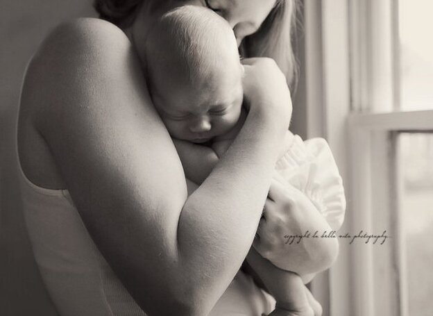 Sarah says photos like this, of her and Finn, helped her see who she is now.
