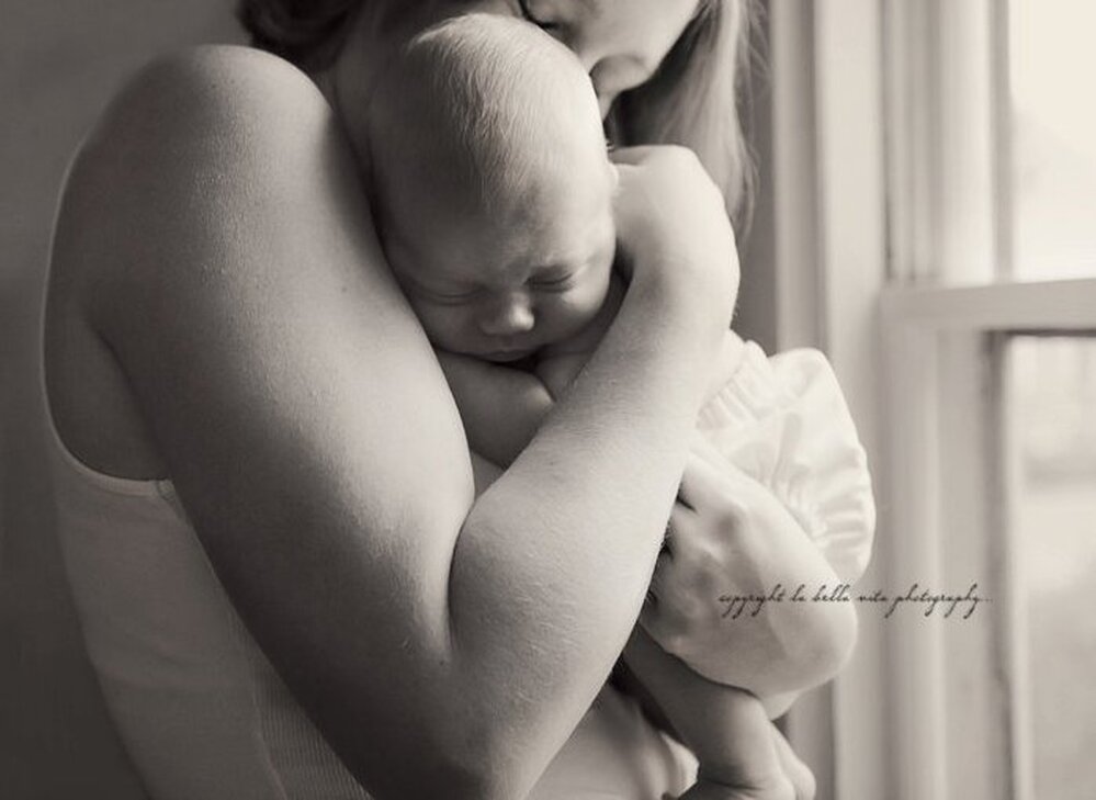 Sarah says photos like this, of her and Finn, helped her see who she is now.
