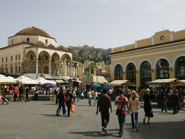 Athens' Monastiraki neighborhood is a meeting place for Greek and Ottoman culture. Case in point: the 18th-century Tzistarakis Mosque (left) sits below the Acropolis (center) and serves as a focal point for Monastiraki Square.