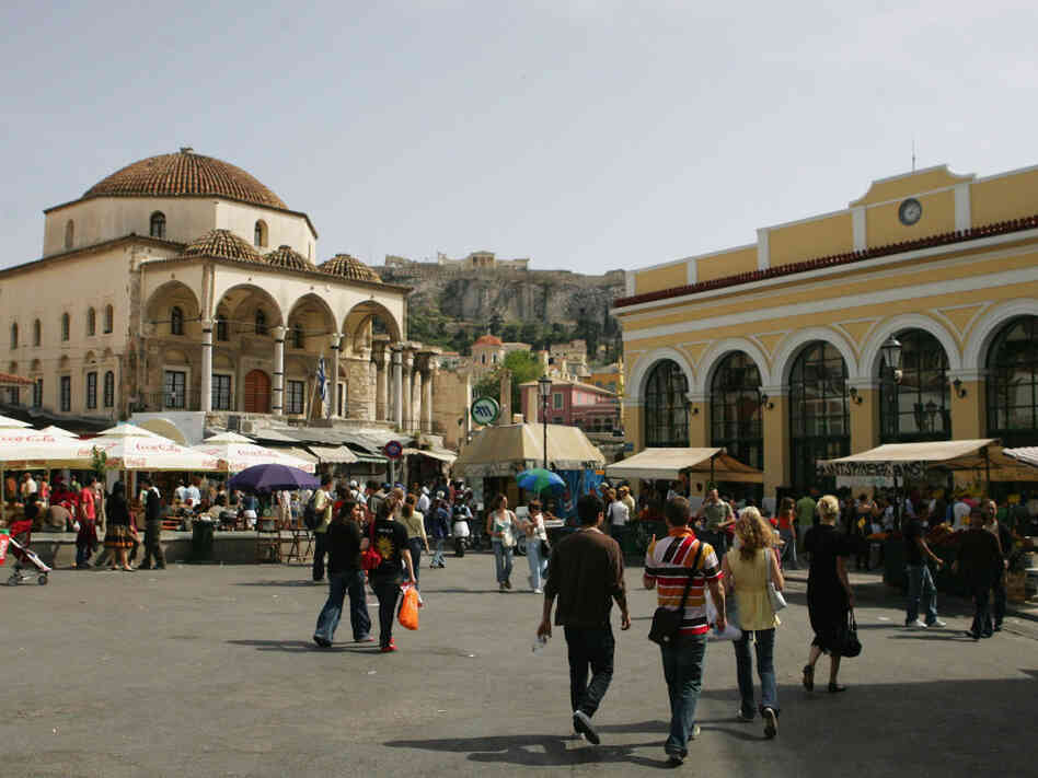 Athens' Monastiraki neighborhood is a meeting place for Greek and Ottoman culture. Case in point: the 18th-century Tzistarakis Mosque (left) sits below the Acropolis (center) and serves as a focal point for Monastiraki Square.