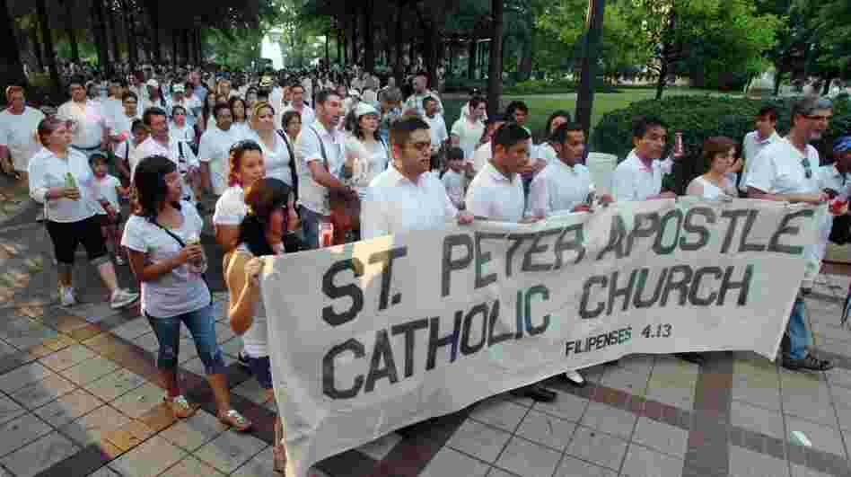 In June, marchers protested Alabama's new law cracking down on illegal immigration. The state's United Methodist, Episcopal and Roman Catholic churches have sued, arguing the law that's set to take effect Sept. 1 violates their religious freedom.