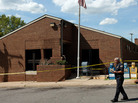 Louisa County official walks the perimeter of the Mineral Virginia Post Office after is was closed from earthquake-related structural damage, Aug. 23, 2001. Louisa County official walks the perimeter of the Mineral Virginia Post Office after is was closed from earthquake-related structural damage, Aug. 23, 2001.