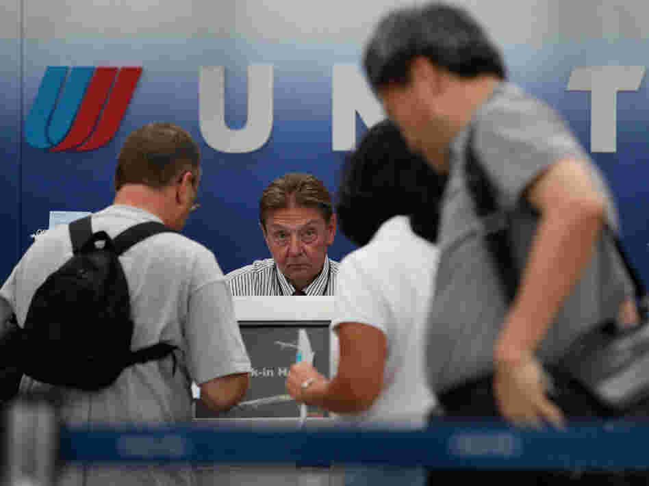 Passengers wait in line at the United Airlines terminal at Chicago's O'Hare airport in 2009 after a computer malfunction caused long delays and the cancellation of some United flights.