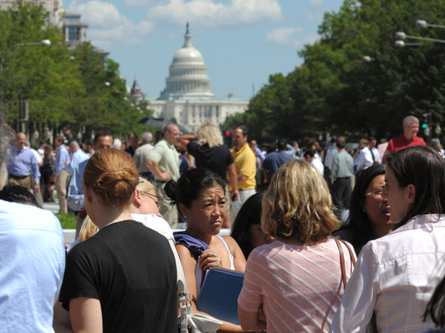 People gather on Freedom Plaza in Washington, D.C., after a earthquake on Tuesday.