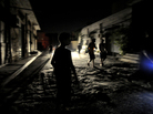 Young boys on a dark street in Tripoli late last night (Aug. 22, 2011). Fighting flared again today in the Libyan capital. Young boys on a dark street in Tripoli late last night (Aug. 22, 2011). Fighting flared again today in the Libyan capital.