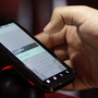 A buyer tests a Motorola Droid phone in this photo from January. Google purchased Motorola for $12.5 billion, gearing up in a patent war that has seen corporations try to pummel their competitors. A buyer tests a Motorola Droid phone in this photo from January. Google purchased Motorola for $12.5 billion, gearing up in a patent war that has seen corporations try to pummel their competitors.