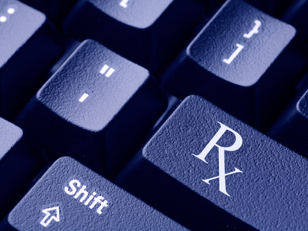 Close-up of the Rx prescription symbol on a computer keyboard.