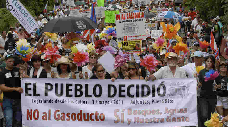 Demonstrators march during a May 1 protest against the proposed construction of a 92-mile gas pipeline in Adjuntas, Puerto Rico. Puerto Rico Gov. Luis Fortuno has made the project a central goal of his administration, despite protest from communities affected. Demonstrators march during a May 1 protest against the proposed construction of a 92-mile gas pipeline in Adjuntas, Puerto Rico. Puerto Rico Gov. Luis Fortuno has made the project a central goal of his administration, despite protest from communities affected.