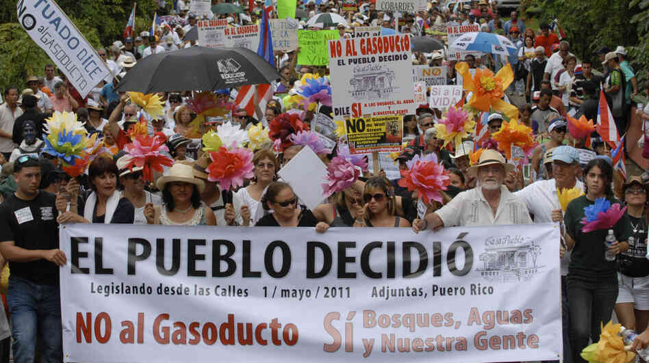 Demonstrators march during a May 1 protest against the proposed construction of a 92-mile gas pipeline in Adjuntas, Puerto Rico. Puerto Rico Gov. Luis Fortuno has made the project a central goal of his administration, despite protest from communities affected. Demonstrators march during a May 1 protest against the proposed construction of a 92-mile gas pipeline in Adjuntas, Puerto Rico. Puerto Rico Gov. Luis Fortuno has made the project a central goal of his administration, despite protest from communities affected.