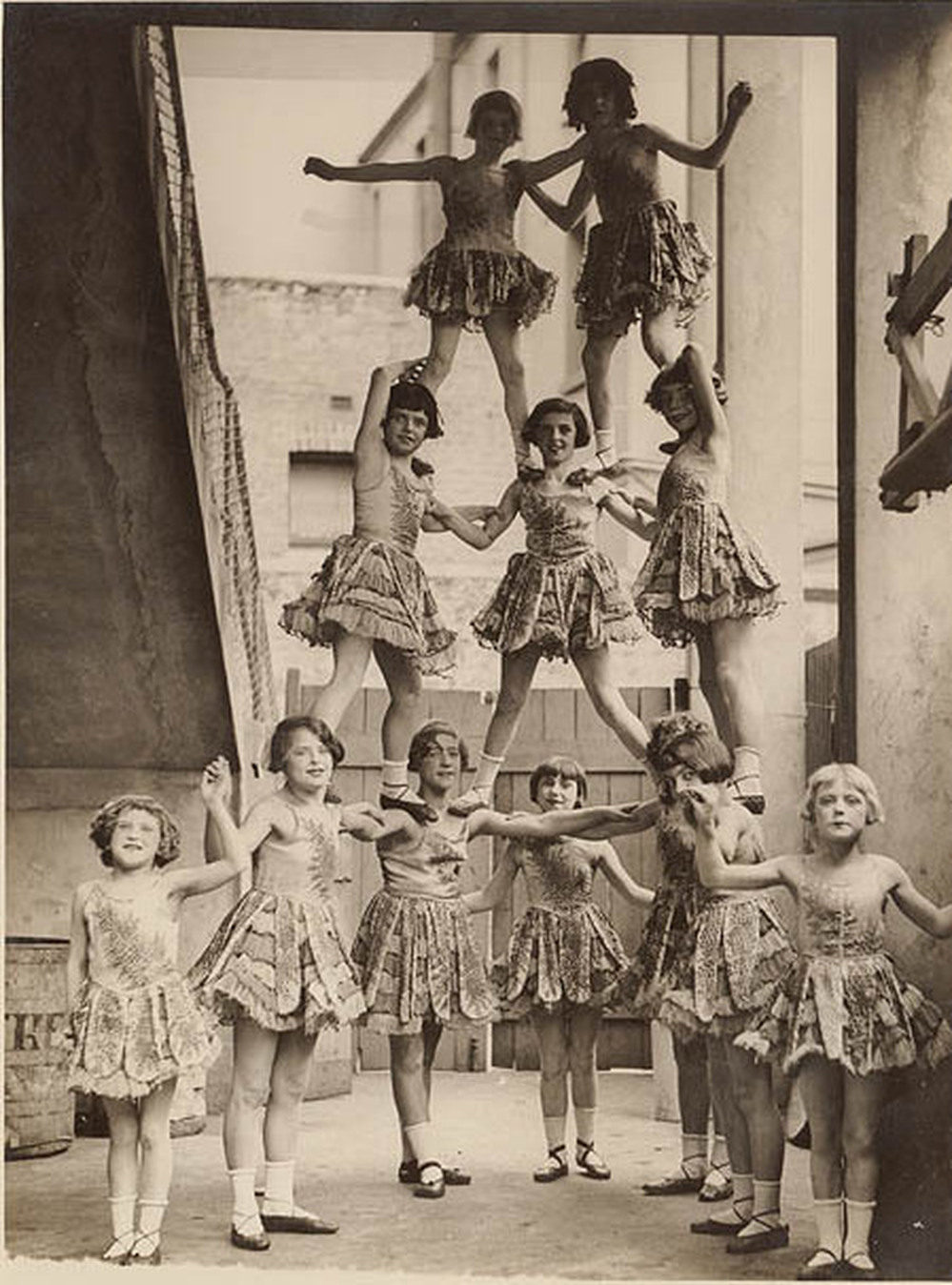 Good production support is like the third girl from the left at the bottom of this human pyramid: rock-solid, handled with aplomb and grace (Look at her feet!)
