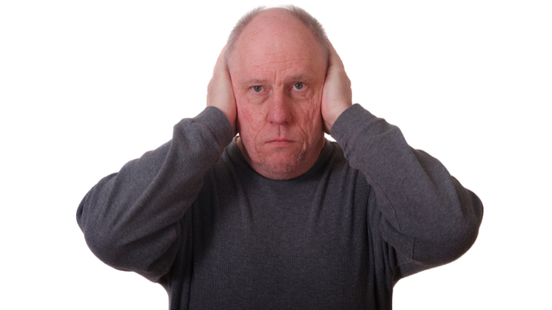 A man covering his ears.