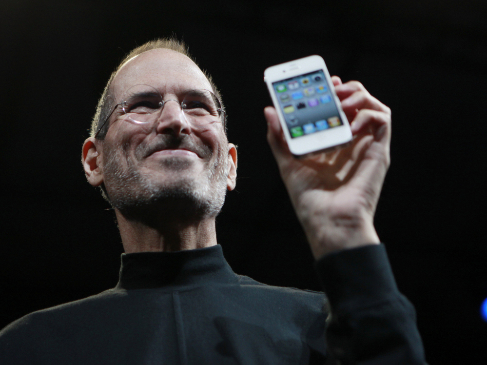 Steve Jobs,  the  now-former CEO of Apple, holds up an iPhone at the Apple Worldwide   Developers Conference in San  Francisco in June 2010. Jobs announced on  Wednesday that  he would be resigning as CEO of Apple.