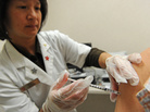Pharmacist Kristy Hennessee administers a vaccination against whooping cough at a Walgreen's pharmacy in Pasadena, Calif. last year. Pharmacist Kristy Hennessee administers a vaccination against whooping cough at a Walgreen's pharmacy in Pasadena, Calif. last year.